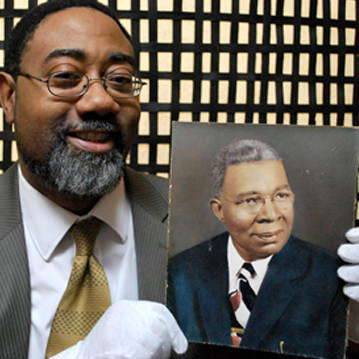 Person holds image from family photographic archive