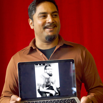 Person holds phone with picture from family photographic archive