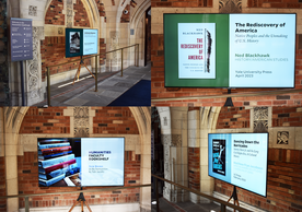Four photos of a monitor displaying book covers in the front entrance of the Humanities Quadrangle.